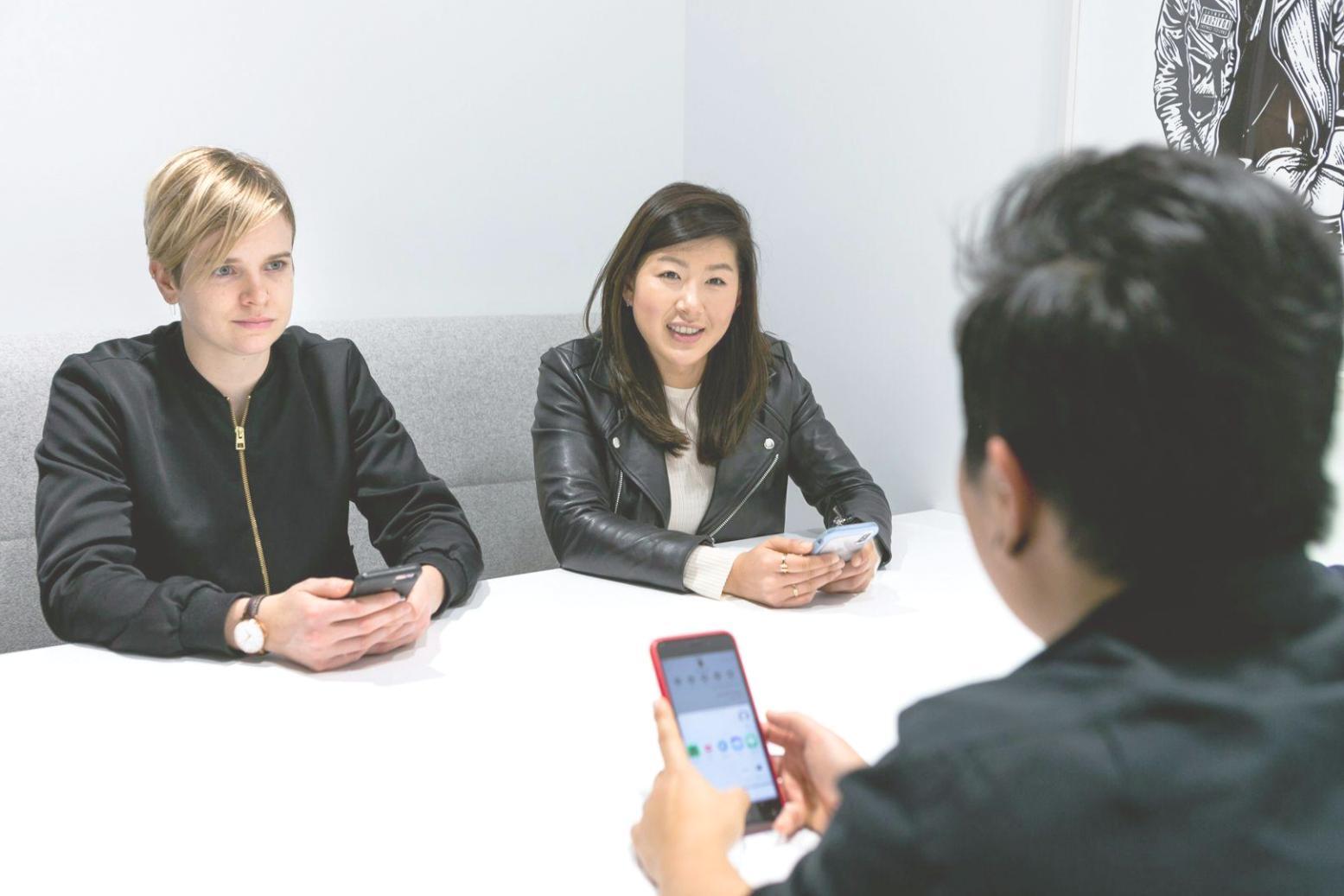 Professional business collaboration meeting with financial documents and analysis charts