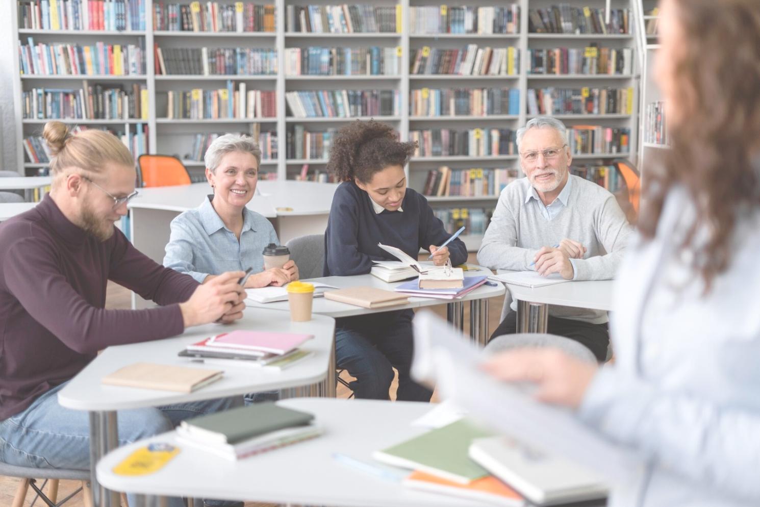 Business professionals reviewing partnership agreement documents and financial projections